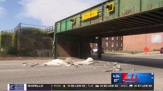  Another truck loses its roof to Davenport’s infamous Brady Street bridge