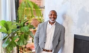 Devontae Brooks, loan officer with Rate, to host a ribbon-cutting and open house