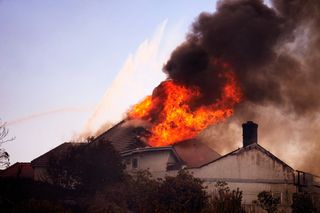 Coastal homes burn as hot winds fuel California fires