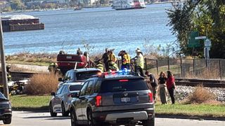  Car crashes, lands upside down on Davenport train tracks