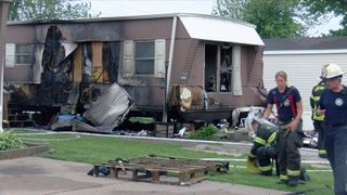 Crews battle early morning mobile home fire