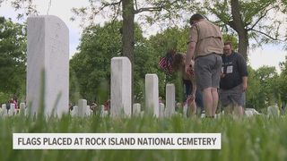 Thousands of flags placed at graves at Rock Island National Cemetery