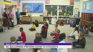 Professional ballet dancers teach elementary students a few moves
