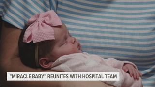 Dubuque miracle baby returns to thank staff that saved her